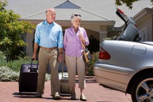 a person carrying luggage and going on a trip